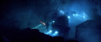 Movie still from “Bloodshot” (2020), directed by Dave Wilson – Two men are walking through a tunnel in the dark; Extreme Wide shot, High angle