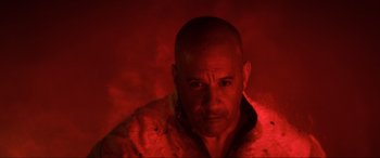 Movie still from “Bloodshot” (2020), directed by Dave Wilson – A bald man in a red light with a beard; Close Up shot, High angle