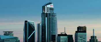 Movie still from “Bloodshot” (2020), directed by Dave Wilson – A tall skyscraper that has been lit up; Extreme Wide shot, Low angle