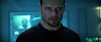 Movie still from “Bloodshot” (2020), directed by Dave Wilson – A person wearing a red shirt; Close Up shot, Over the shoulder angle