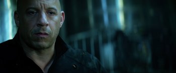 Movie still from “Bloodshot” (2020), directed by Dave Wilson – A man with a bald head wearing a black jacket; Close Up shot, Low angle