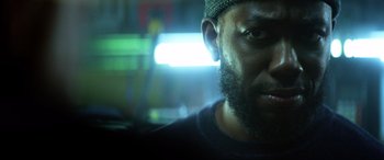 Movie still from “Bloodshot” (2020), directed by Dave Wilson – A person wearing a hat; Close Up shot, Low angle