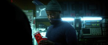 Movie still from “Bloodshot” (2020), directed by Dave Wilson – A man holding a box in his hands; Close Up shot, Over the shoulder angle