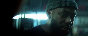 Movie still from “Bloodshot” (2020), directed by Dave Wilson – A person wearing a hat; Close Up shot, Low angle