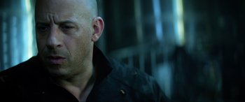Movie still from “Bloodshot” (2020), directed by Dave Wilson – A man with a bald head wearing a black shirt; Close Up shot, Low angle