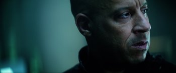 Movie still from “Bloodshot” (2020), directed by Dave Wilson – A man's face with ear buds in his ears; Close Up shot, Low angle