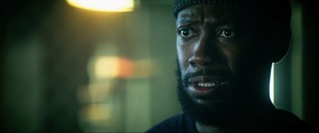 Movie still from “Bloodshot” (2020), directed by Dave Wilson – A person with a beard; Close Up shot, Over the shoulder angle