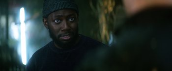 Movie still from “Bloodshot” (2020), directed by Dave Wilson – A person wearing a hat; Close Up shot, Over the shoulder angle