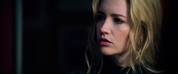 Movie still from “Bloodshot” (2020), directed by Dave Wilson – A person with long blonde hair; Close Up shot, Low angle