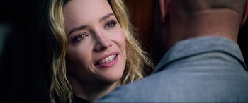 Movie still from “Bloodshot” (2020), directed by Dave Wilson – A person with a smile on their face; Close Up shot, Over the shoulder angle