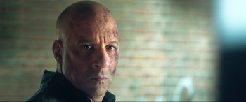 Movie still from “Bloodshot” (2020), directed by Dave Wilson – A bald man with a face full of blood; Close Up shot, Over the shoulder angle