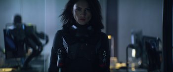 Movie still from “Bloodshot” (2020), directed by Dave Wilson – A woman in a black outfit holding a pair of beer bottles; Close Up shot, Low angle