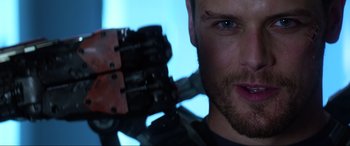 Movie still from “Bloodshot” (2020), directed by Dave Wilson – A man's face with a gun in his hand; Close Up shot, Over the shoulder angle