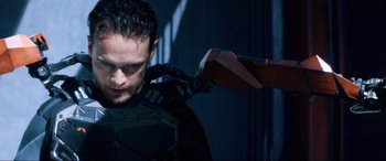Movie still from “Bloodshot” (2020), directed by Dave Wilson – A person holding a gun on their shoulder; Medium shot, Low angle
