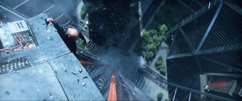 Movie still from “Bloodshot” (2020), directed by Dave Wilson – A man standing on the side of a tall building; Wide shot, Overhead angle