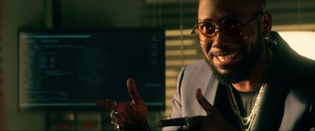 Movie still from “Bloodshot” (2020), directed by Dave Wilson – A man in a suit and tie holding his hand up to the camera; Close Up shot, Over the shoulder angle