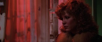 Movie still from “Blow Out” (1981), directed by Brian De Palma – A person wearing a fur coat; Close Up shot, Over the shoulder angle