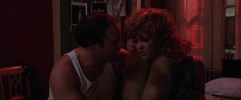 Movie still from “Blow Out” (1981), directed by Brian De Palma – A man and a woman are looking at one another; Close Up shot, Low angle