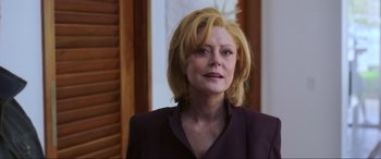 Movie still from “Blue Beetle” (2023), directed by Angel Manuel Soto – A person with blonde hair; Close Up shot, Over the shoulder angle