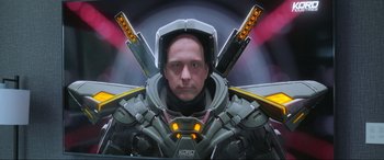 Movie still from “Blue Beetle” (2023), directed by Angel Manuel Soto – A man with a helmet on and a pair of swords in his hands; Close Up shot, Low angle