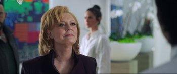 Movie still from “Blue Beetle” (2023), directed by Angel Manuel Soto – A woman in a black jacket and a woman in a white shirt; Close Up shot, Over the shoulder angle