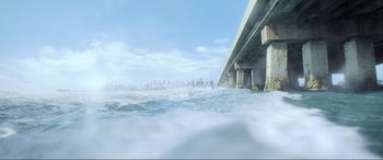Movie still from “Blue Beetle” (2023), directed by Angel Manuel Soto – A view of a bridge from the water; Extreme Wide shot, High angle
