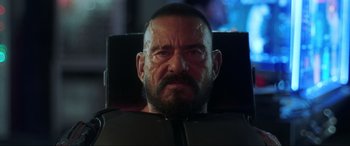 Movie still from “Blue Beetle” (2023), directed by Angel Manuel Soto – A person with a beard; Close Up shot, Low angle