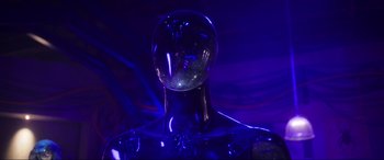 Movie still from “Blue Beetle” (2023), directed by Angel Manuel Soto – A mannequin with a glass head in a dark room; Close Up shot, Low angle
