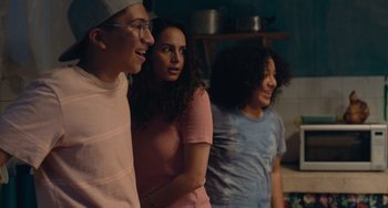 Movie still from “Blue Miracle” (2021), directed by Julio Quintana – A group of young people standing next to each other; Medium shot, Over the shoulder angle