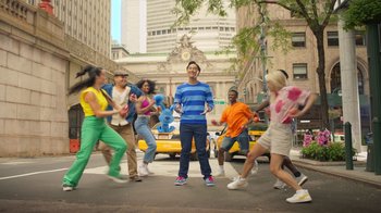 A group of young people dancing on the street
