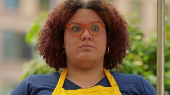 Movie still from “Blue's Big City Adventure” (2022), directed by Matt Stawski – A woman with a surprised look on her face; Close Up shot, Over the shoulder angle