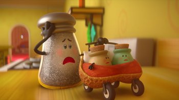 A salt shaker and a wagon with jars on it