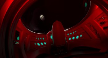 Movie still from “Blush” (2021), directed by Joe Mateo – A view of the moon from inside a space ship; Extreme Wide shot, Overhead angle