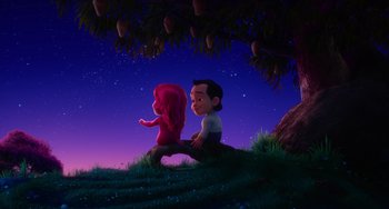 Movie still from “Blush” (2021), directed by Joe Mateo – A couple of people sitting under a tree at night; Wide shot, Low angle