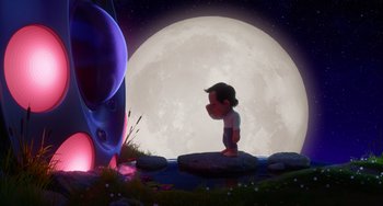 Movie still from “Blush” (2021), directed by Joe Mateo – An animated scene of a boy standing in front of a giant moon; Extreme Wide shot, Low angle