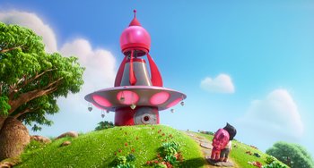Movie still from “Blush” (2021), directed by Joe Mateo – A pink and white cartoon house on a hill; Extreme Wide shot, Low angle