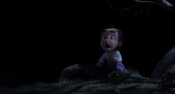 Movie still from “Blush” (2021), directed by Joe Mateo – An image of an animated character that is sitting in the grass; Medium shot, High angle