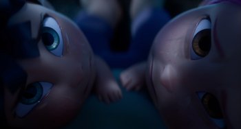 Movie still from “Blush” (2021), directed by Joe Mateo – View of two babies laying on their backs; Extreme Close Up shot, Overhead angle
