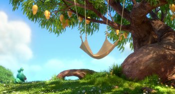 Movie still from “Blush” (2021), directed by Joe Mateo – A hammock hanging from a tree in the middle of a field; Extreme Wide shot, Low angle