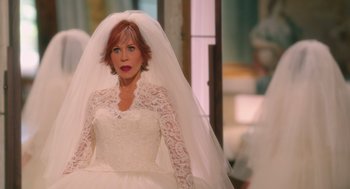Movie still from “Book Club: The Next Chapter” (2023), directed by Bill Holderman – A woman in a wedding dress and veil; Medium shot, Over the shoulder angle