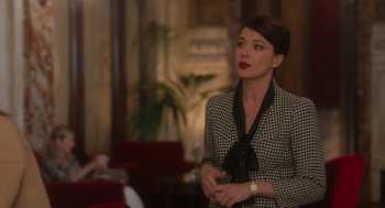 Movie still from “Book Club: The Next Chapter” (2023), directed by Bill Holderman – A woman in a black and white dress standing in a room; Medium shot, Over the shoulder angle