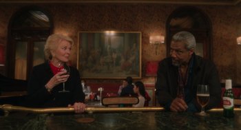 Movie still from “Book Club: The Next Chapter” (2023), directed by Bill Holderman – A man and a woman sitting at a bar; Medium shot, Low angle
