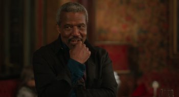 Movie still from “Book Club: The Next Chapter” (2023), directed by Bill Holderman – An older black man with his hand under his chin; Close Up shot, Over the shoulder angle