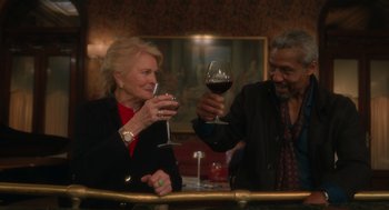 Movie still from “Book Club: The Next Chapter” (2023), directed by Bill Holderman – A man and a woman holding wine glasses; Medium shot, Over the shoulder angle