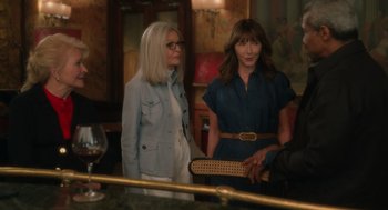 Movie still from “Book Club: The Next Chapter” (2023), directed by Bill Holderman – Two women standing next to each other in front of a bar; Medium shot, Over the shoulder angle