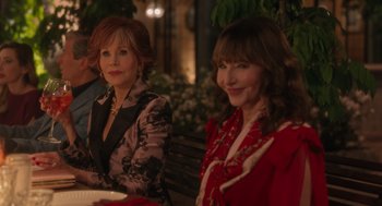 Movie still from “Book Club: The Next Chapter” (2023), directed by Bill Holderman – Two women sitting next to each other on a park bench; Medium shot, Over the shoulder angle