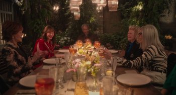 Movie still from “Book Club: The Next Chapter” (2023), directed by Bill Holderman – A group of people sitting at a dinner table; Wide shot, High angle