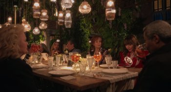Movie still from “Book Club: The Next Chapter” (2023), directed by Bill Holderman – A group of people sitting at a dinner table; Wide shot, High angle