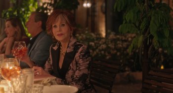 Movie still from “Book Club: The Next Chapter” (2023), directed by Bill Holderman – An older woman sitting at a table with a plate; Medium shot, Over the shoulder angle