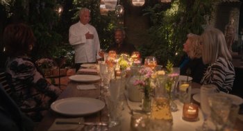 Movie still from “Book Club: The Next Chapter” (2023), directed by Bill Holderman – A group of people sitting at a dinner table; Wide shot, High angle